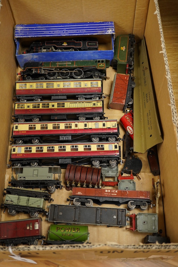 A collection of Hornby Dublo for 3-rail running, including two locomotives; a BR Duchess of Montrose, and a BR Standard Class 4MT 2-6-4T, together with four carmine and cream bogie coaches, nine freight wagons, a signal